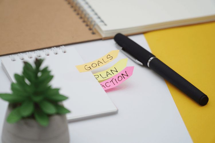 A small notebook and a pen on an office